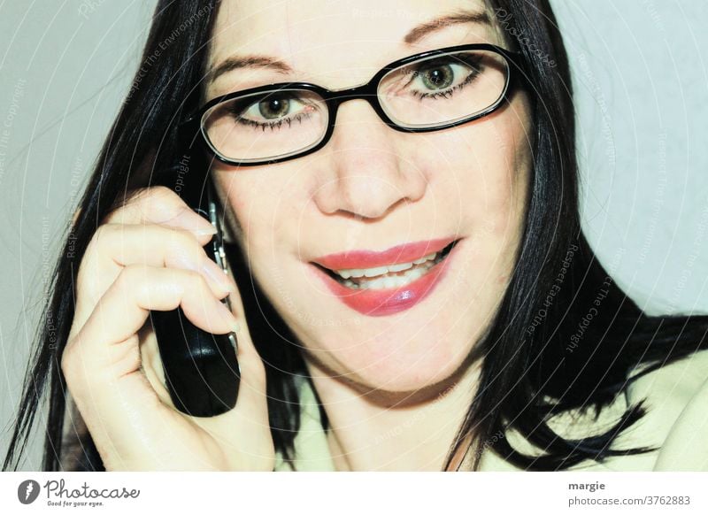 A woman with glasses on the phone Woman Young woman Feminine Face of a woman Telephone To call someone (telephone) Receiver Cellphone Eyeglasses