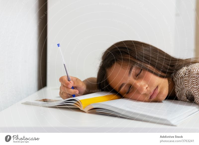 Environmentalist Moral education Size Tired student sleeping at table - a Royalty Free Stock Photo from Photocase