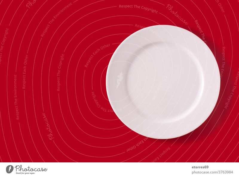 White plate on red background christmas concept copyspace crockery dinner dishware eat empty mockup object okate white