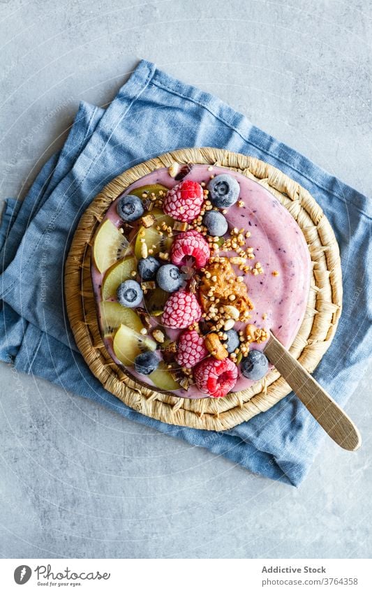Appetizing smoothie bowl on table breakfast super food morning berry yogurt healthy delicious fresh fruit tasty yummy kiwi blueberry raspberry nutrition meal