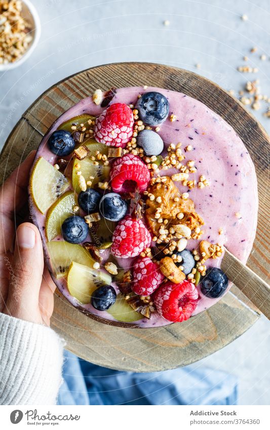 Appetizing smoothie bowl on table breakfast super food morning berry yogurt healthy delicious fresh fruit tasty yummy kiwi blueberry raspberry nutrition meal