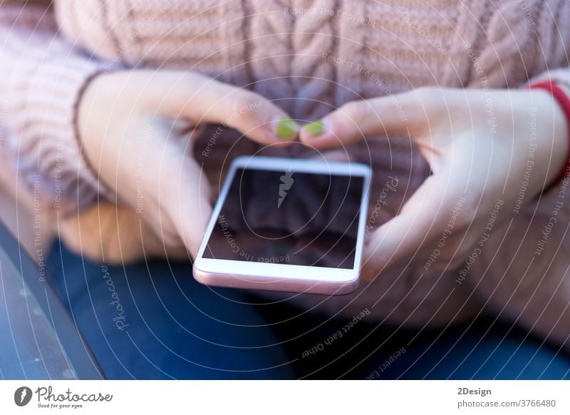 Closeup of a woman using a mobile phone hand person technology holding female communication smartphone closeup device modern internet message connection