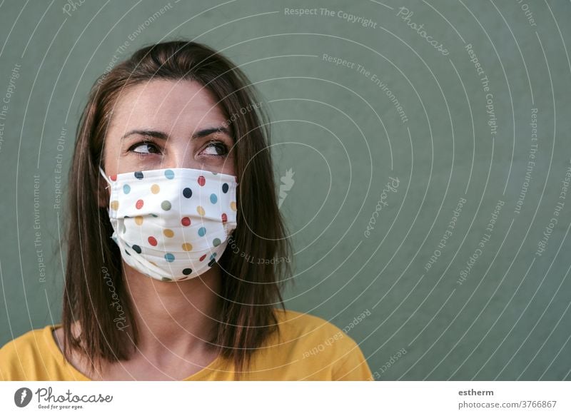 Close-up of young woman with medical mask coronavirus epidemic pandemic quarantine covid-19 symptom medicine health background blur positive test hospital city