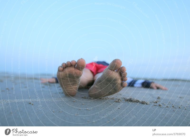 child lying down on a sandy beach lay laying laying game Laying Down Detail Close-up Ankle joint baby feet Stretching Toes Skin Soft candid moment Small