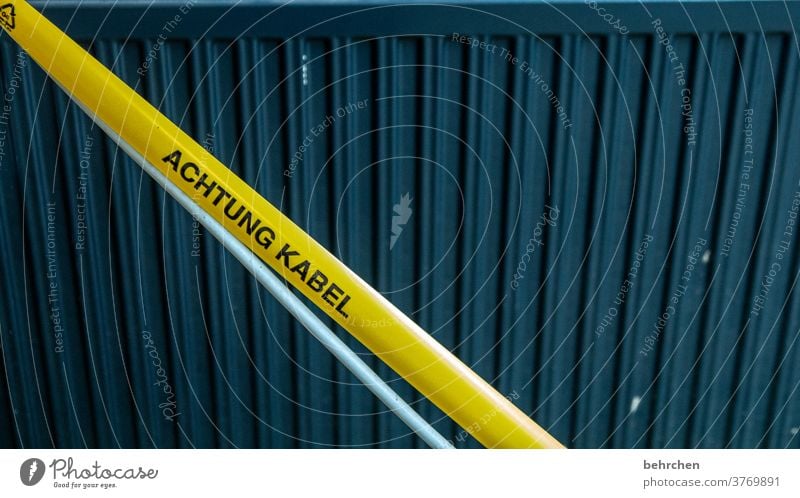 ahhh, there's a cable! Cable Adhesive tape Warn Clue Construction site esteem peril attention Yellow Safety Risk of injury watch Caution Warning sign Signage
