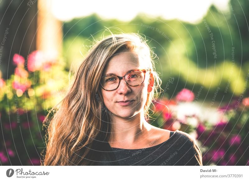 young natural woman with glasses smiles Eyeglasses Young woman pretty Authentic real Reflection Sunlight already Blonde Human being portrait