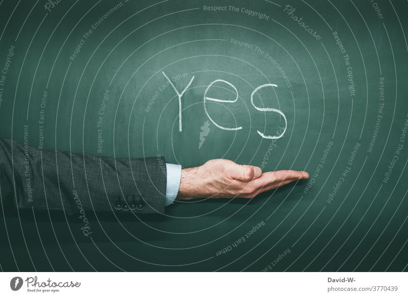 YES - hand points to something yes Yes Americas Positive Result choice Word English USA Remark Chalk Blackboard