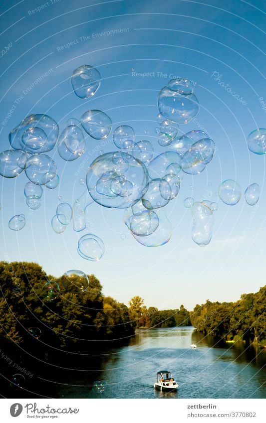 Soap bubbles over the Hohenzollern Canal soap bubbles Berlin Bubble soap bubble artist Transparent celebration River shape Joy Birthday Sky Channel