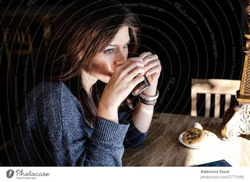Woman drinking coffee in cafe woman morning enjoy hot beverage coffee shop relax female delicious breakfast peaceful cozy fresh tasty mug refreshment cup rest