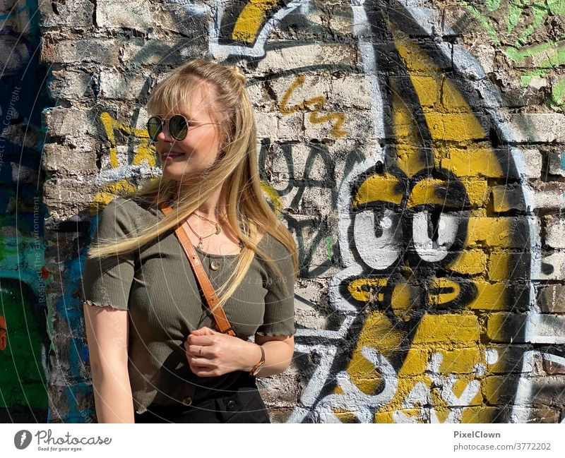 Young woman in front of a graffiti Woman portrait Feminine Adults Human being Exterior shot Face long hairs