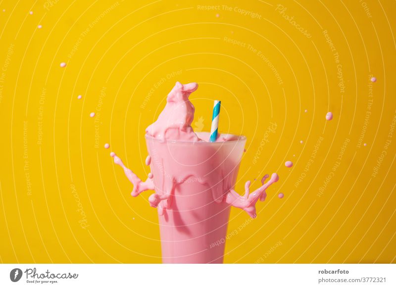 glass of strawberry smoothie on yellow and pink background sweet fresh milkshake drink refreshment beverage yogurt isolated blended dairy healthy food diet