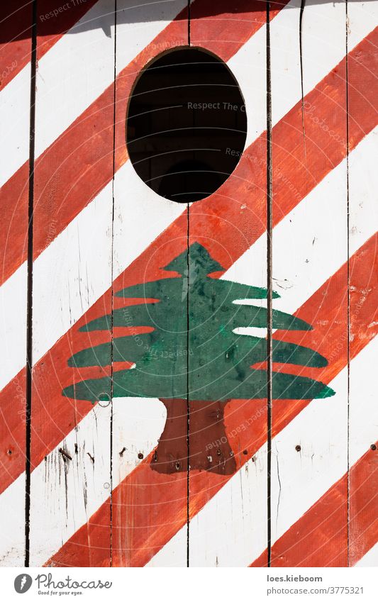 Lebanese flag painted on a security house, Tyre, Lebanon cedar country design national old pattern symbol texture vintage wall weathered wood wooden color
