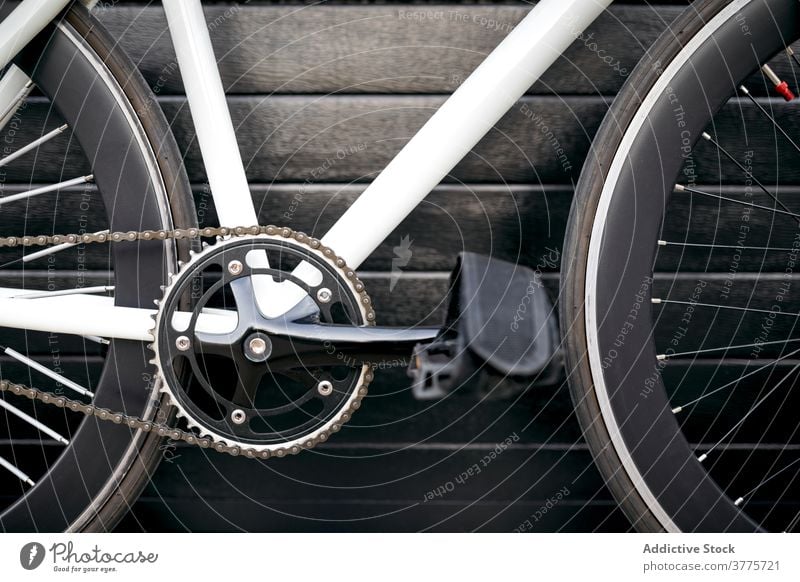 Cropped modern bicycle bike vehicle city street urban trendy transport town design inspiration pavement building ride contemporary outdoors horizontal crop wall