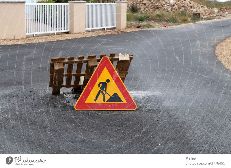 Road sign pending reconstruction of a road repair warning traffic symbol indication attention caution illustration notice street danger safety signal isolated