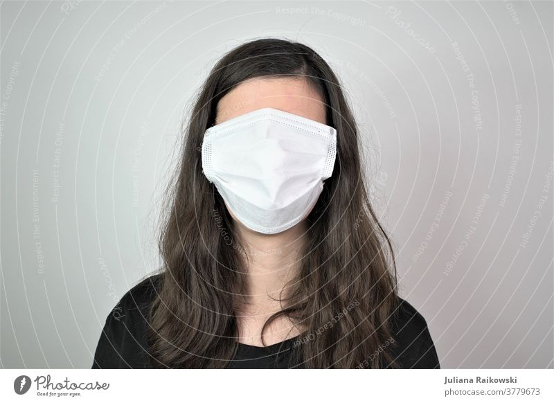 Woman with breathing mask on face No face Respirator mask Face Human being Mask portrait Protection Breathe Head Threat Dangerous coronavirus Fear Illness