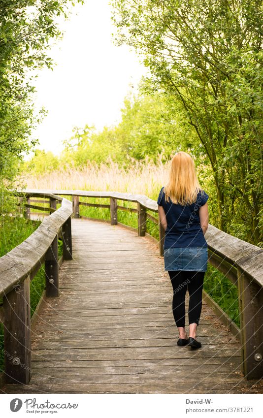 Young woman strolls through nature Summer already tranquillity Lanes & trails bridge Handrail Woman pretty warm by oneself gap