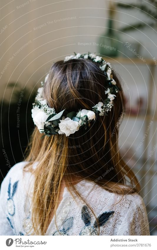 Woman in floral wreath on head in apartment flower woman elegant tender rose delicate accessory gentle female beauty plant romantic bloom blossom decor
