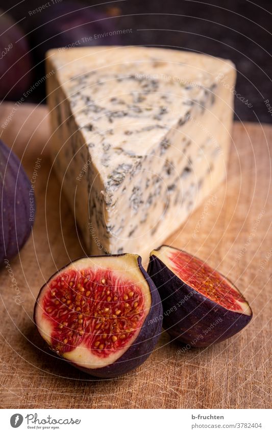 Blue cheese with figs on wooden board mould cheese Nutrition Vegetarian diet Healthy Eating Food Fresh fruit Food photograph Cheese Biological slice Figs