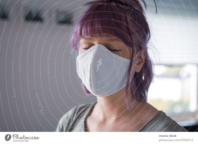 Young woman with mask Corona Pandemic coronavirus Healthy Colour photo Copy Space Mask obligation pandemic tired Risk of infection covid-19