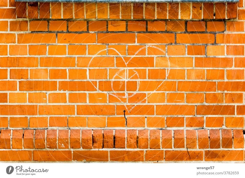 A heart drawn with chalk and a ypsilon sign on a brick wall Graffito Chalk drawing Wall (barrier) Brick wall Clinker Wall Wall (building) Graffiti Exterior shot