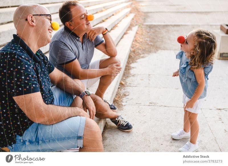 Gay couple with kid having fun lgbt family gay parent play homosexual cheerful child adopt daughter dad father together relationship love happy bonding