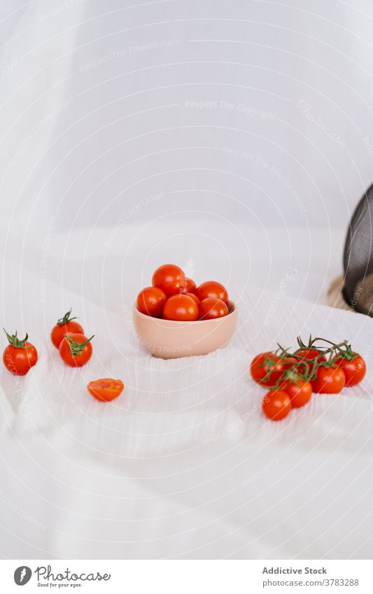 Fresh tomatoes on cloth in kitchen cherry tomato fresh vegetable ripe delicious harvest healthy food tasty gourmet vegetarian cuisine culinary yummy textile