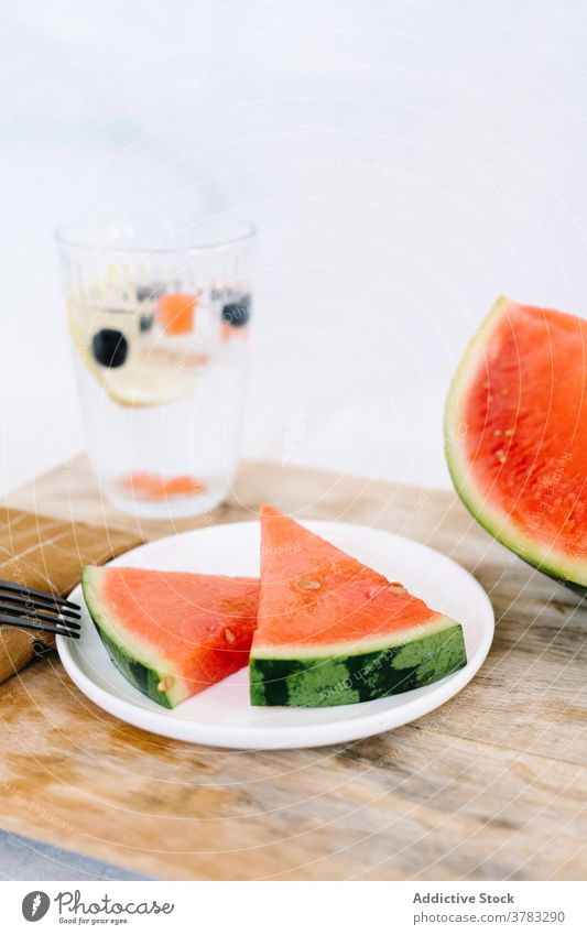 Slices of fresh watermelon on plate slice piece delicious fruit serve table refreshment kitchen wooden food tasty nutrition vegetarian meal sweet portion
