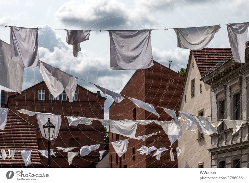 Kiezfest: The white laundry flutters in the wind Laundry clothesline Wind Sunlight Judder hung Old town köpenick Berlin lanes streets Lantern Tradition