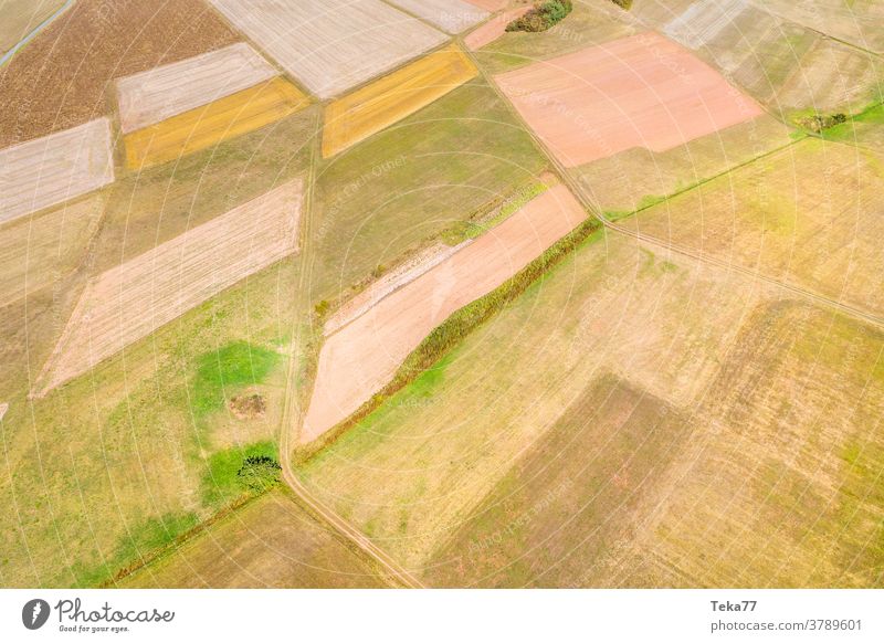 fields and meadows as seen from above farm farming grass field from above meadows from above orange yellow