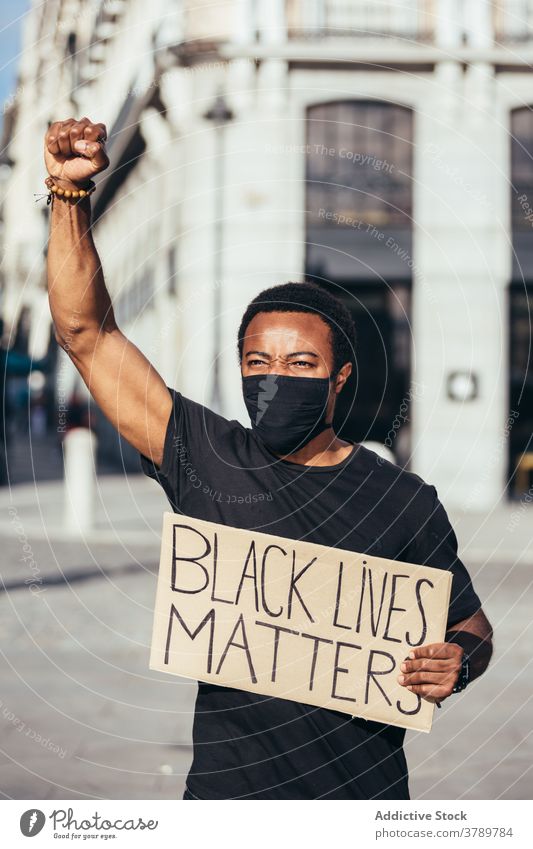 Black man on Black Lives Matter demonstration against police brutality protest people black racism violence lives social justice black lives matter sign