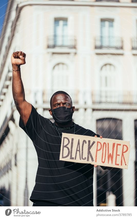 Black man on demonstration against police brutality protest people black racism violence lives social justice black lives matter sign american activism racial