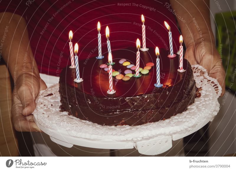 Birthday cake with candles shoulder stand Colour photo Feasts & Celebrations Cake Baked goods cute Delicious Gateau Chocolate cake celebrations stop Hand