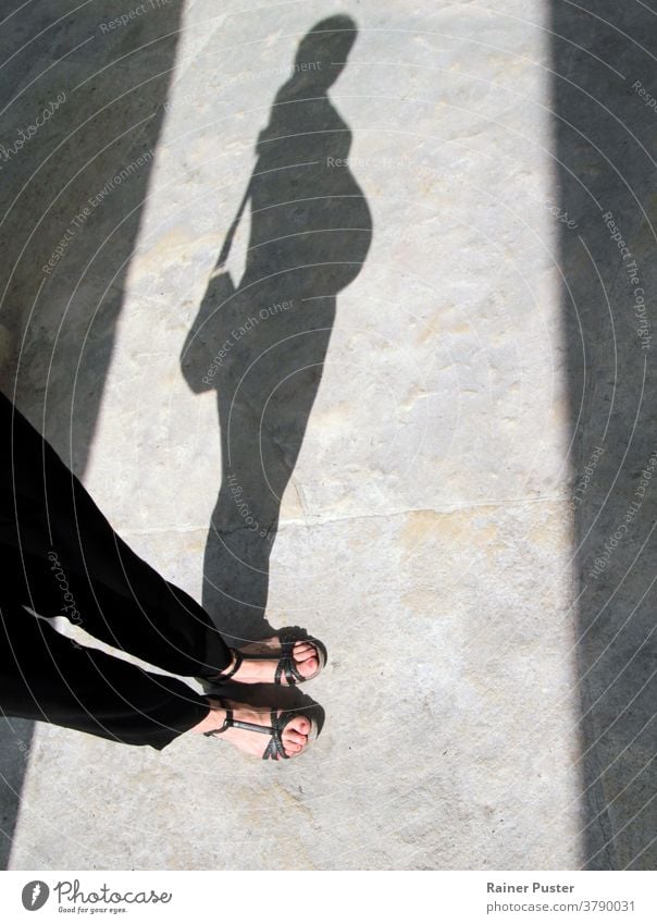 Shadow of a pregnant woman baby belly concept family feet female foot girl happiness home leg life lovely motherhood person pregnancy pregnant belly
