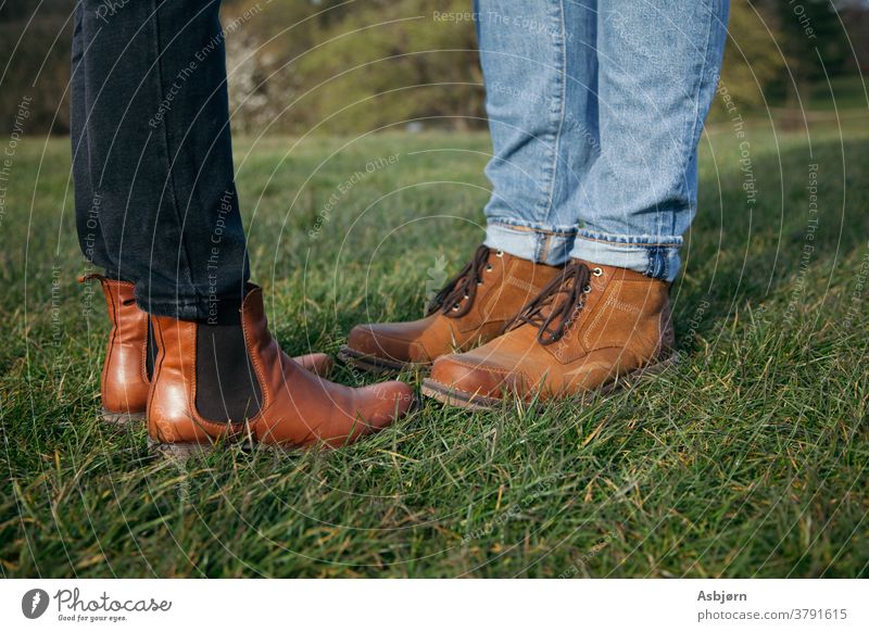 Boots of man and woman grass outside love couple Close-up Grass surface Jeans Adults Couple Together 2 Man Woman Colour photo Partner 18 - 30 years