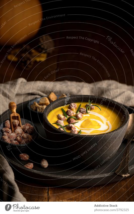 Appetizing pumpkin cream soup in bowl on table dish serve lunch bread crouton healthy food vegetarian wooden meal delicious organic gourmet vegetable cuisine