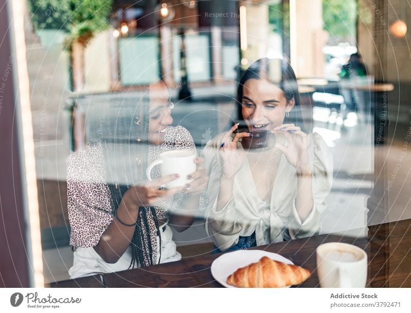 Young stylish women having coffee break in cafe friend meeting happy cheerful together chat style gather enjoy trendy young millennial drink girlfriend