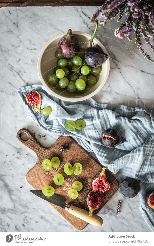 Tasty fruits on table at home arrangement grape fig kitchen sweet towel fresh vitamin healthy food marble delicious organic tasty nutrition natural meal