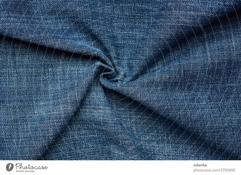 curled blue jeans texture, full frame apparel backdrop background canvas casual closeup cloth clothing color cotton dark denim design detail fabric fashion