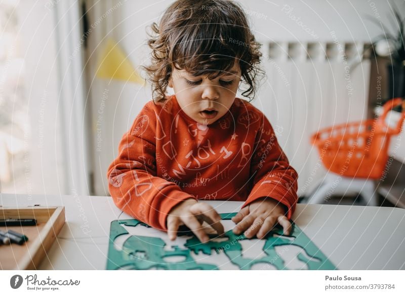 Child playing at home Letters (alphabet) Latin alphabet Characters Black Language Capital letter Colour photo Typography Word Communicate Children's game