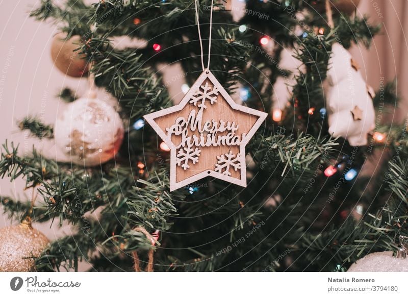 A Christmas star is hanging on the Christmas tree. Christmas decoration. Close up christmas decorative celebration merry christmas december christmas decoration
