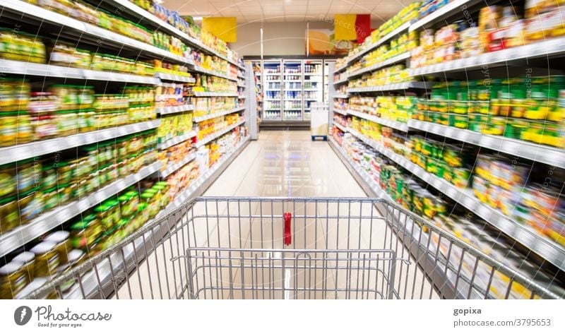 Shopping trolley in the supermarket Supermarket Shopping Trolley Food Retail sector Goods shelf Trade assortment sale interior Sell Food Retailing Offer
