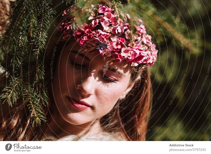 Tender young woman in flower wreath standing in forest romantic nature portrait tender charming sensual beautiful female floral style natural gentle fresh calm