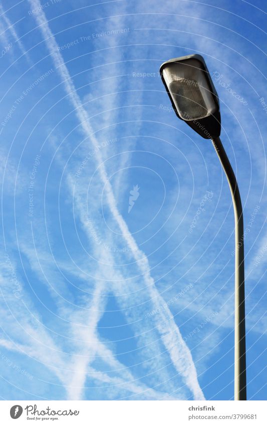 streetlamp in front of sky with contrails sky clouds Clouds Sky blue streak Vapor trail Airplane Flying air traffic Airport Aviation Vacation & Travel Tourism