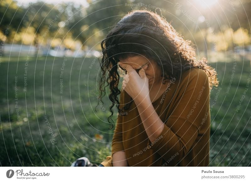 Woman with headache Headache people Caucasian migraine Exterior shot female person young woman Colour photo Adults caucasian depression Exhaustion tired
