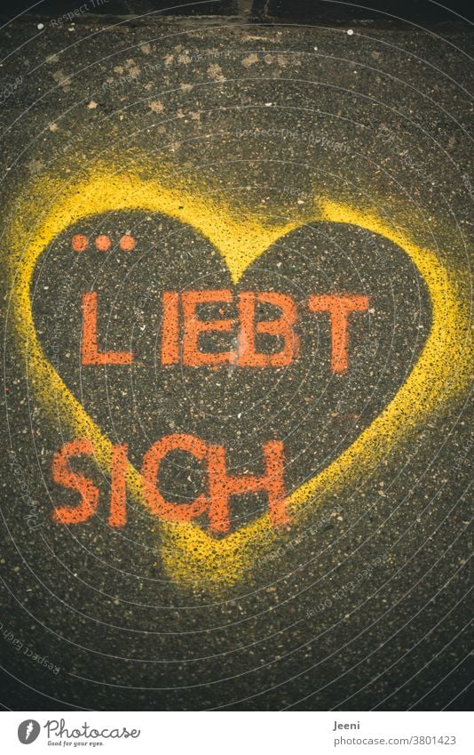 A path with street paintings with the words "...LOVES YOU" Love Self-Love Street painting Chalk Asphalt off Creativity Yellow Strong same sex Homosexual