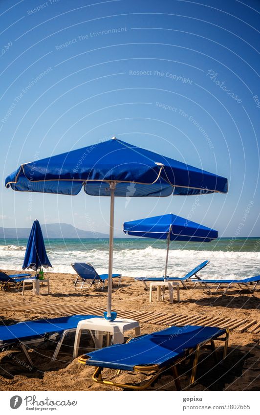 Empty deckchairs on the beach Beach Deckchair Sunshade Ocean Crete Greece void Loneliness relaxation wanderlust Wanderlust Longing Moody Freedom tranquillity
