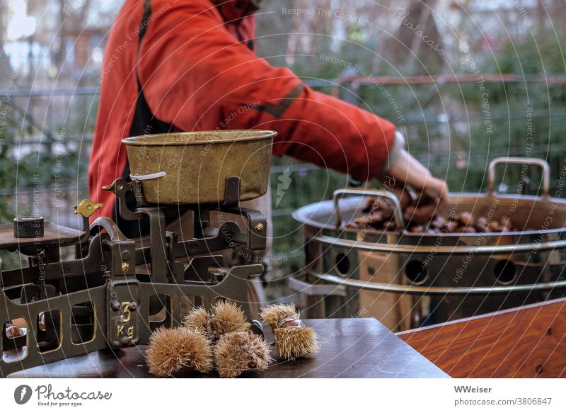 Roasted chestnuts are particularly popular on the market on cold days Sweet chestnut Chestnuts Markets Market stall toast Frying Baking Hot Eating Delicious
