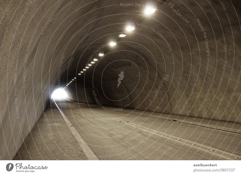 empty illuminated car or road tunnel car tunnel street underpass underground passageway traffic light transportation travel subway cement copyspace copy space