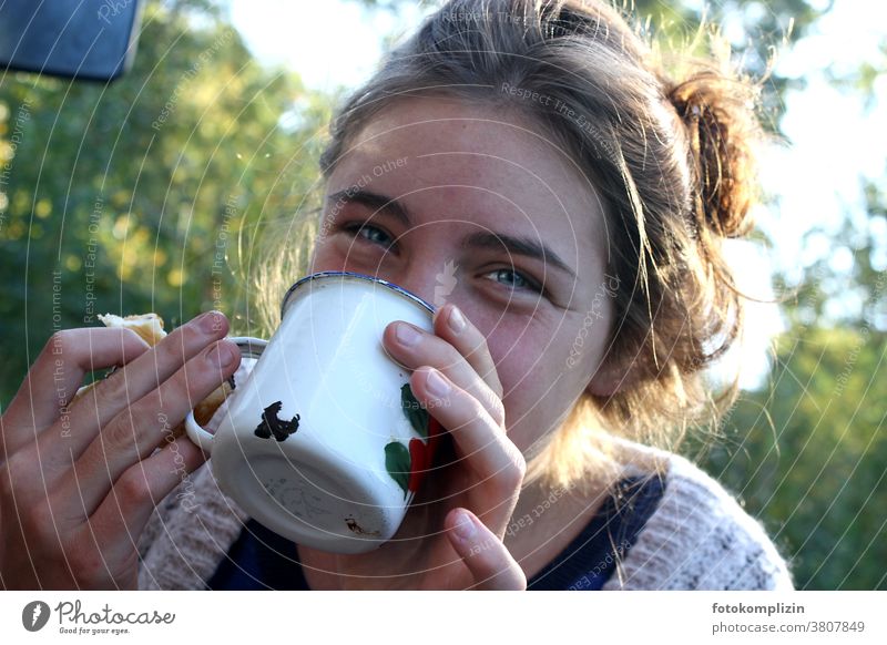 young woman in greenery smiling drinking from enamel cup Drinking Mug Cup Breakfast Camping Hot drink Coffee Beverage Coffee break Coffee cup To have a coffee
