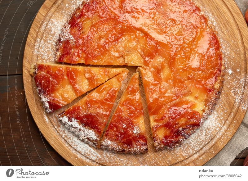 baked round apple pie on wooden board a above american sweet table tart tasty thanksgiving top traditional whole autumn brown cake closeup delicious dessert